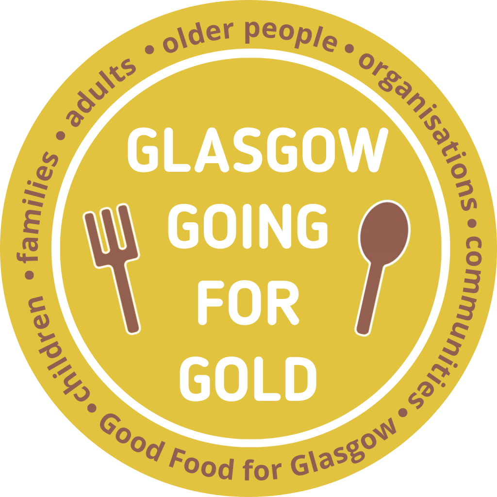 Glasgow Going for Gold - a round logo with white text on a gold background, with a brown fork and spoon on either side of the text. Round the outside of the logo are the words - Good Food for Glasgow. children. families. adults. older people. organisations. communities.